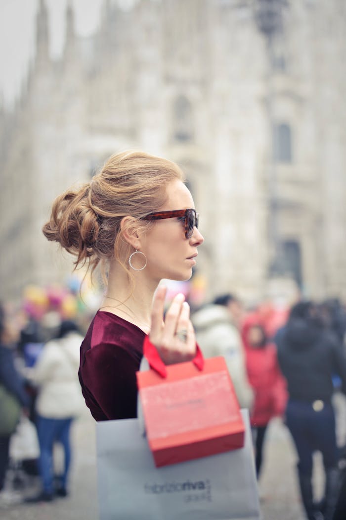 gallery-4 Chic woman with shopping bags in Piazza del Duomo, Milan, Italy.